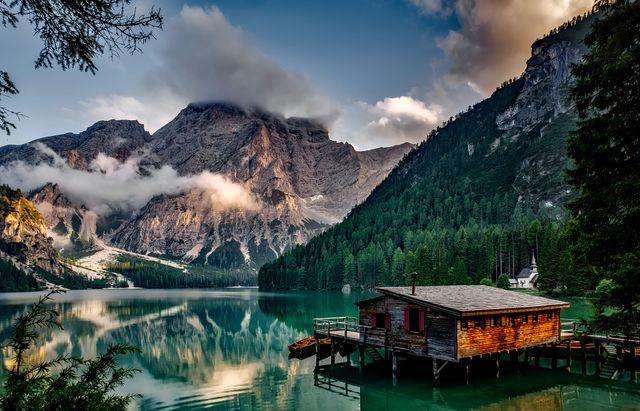 Serene lake at sunrise with mountains